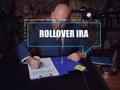 Individual Retirement Accounts ROLLOVER IRA phrase on the screen. Auditor checking financial report AÃÂ rollover IRAÃÂ ÃÂ is a